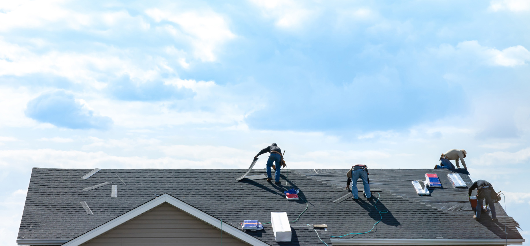 workers on a roof image